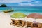 Sun lounges with umbrellas at Ilig Iligan Beach, Boracay Island, Philippines