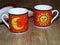 The sun and the moon on two fine porcelain ware tea coffee cups.