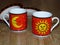 The sun and the moon on two fine porcelain ware tea coffee cups.