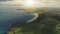 Sun ocean bay coast aerial. Nobody nature landscape. Cliff shore at White Rock Beach. Green valley