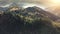 Sun pine forest at mountain peak aerial. Autumn trees at fog. Nobody nature landscape. Mount ridge