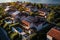 Sun powered homes Aerial perspective of houses with solar installations