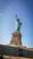 Sun rays blessing the Liberty statue in USA