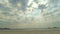Sun Rays Through Clouds On Honey Island Beach - Timelapse - Closeup