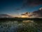 Sun Rays Cut Through Horizon Over Everglades