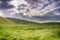 Sun rays illuminating a green meadow, south San Francisco bay, California