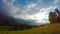 Sun Rays Pass through the Clouds Over the Mountains at Sunset.