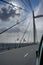 Sun rays passing through clouds in blue sky over 2nd Hoogly Bridge, Kolkata, West Bengal, India