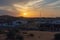 Sun rays pierce the stormy clouds above the sand dunes in the desert of Ras al Khaimah, United Arab Emirates