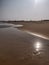 Sun rays reflection   on beach sand in afternoon