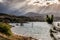 Sun Rays shining through clouds on the Hills of Lake Jindabyne,