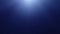 Sun rays underwater in dark blue sea water with copy space