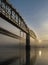 Sun reflecting on the Tamar Bridges in mist, Cornwall