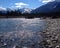 The sun reflects in the water of Kootenay River
