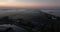 Sun rise in The Netherlands in springsummer, foggy dew in the morning aerial drone overhead view. Holland early morning