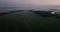 Sun rise in The Netherlands in springsummer, foggy dew in the morning aerial drone overhead view. Holland early morning