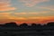 Sun rising in the Libyan desert  uncovering bizarre limestone formations  near Farafra in Egypt