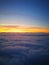 The sun`s rays above the horizon from the clouds. Photos from the aircraft`s ilumyator