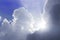 The sun`s rays break through the bluish clouds. the concept of new hope or spiritual uplift