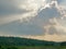 Sun`s rays bursting through the cloud onto the earth