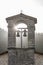 The sun`s rays filter through the bells of the Church of San Montano in Roccaporena, Perugia, Italy