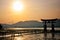 Sun set and holy gate Torii at Miyajima islands