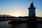 The sun sets behind the Tarrytown Lighthouse