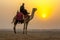 The sun sets over the Sahara Desert in Cairo, Egypt.