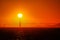 The sun setting behind the Golden Gate Bridge in the San Francisco Bay.