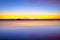 Sun setting beyond horizon, Ruby beach, Washington