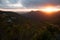 The sun setting over the mountain range of the Robinson pass.