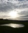 Sun setting over small lake in Leintwardine