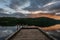 Sun setting over a wooden dock in Inland lake provincial park, British Columbia, Canada