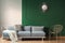 sun shape like mirror on green wall of living room interior with scandinavian sofa with pillows