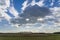 The sun is shielded by the threatening rain clouds over the Bentwoud near Boskoop, the Netherlands