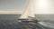 Sun shine at closeup sail boat at ocean bay aerial. Yacht race with beautiful sunny sky at open sea