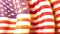 The sun shines through the waving USA flag. USA waving flag for banner design. Festive patriotic design. America holidays