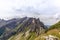 The sun shining on the steep ridge of the Majestic  Schaefler peak in the Alpstein mountain range around the Aescher cliff in