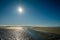 Sun is slowly setting along the Schiermonnikoog summer coastline Netherlands