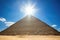 sun-topped pyramid at high noon