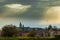 The sun trying to shine through the dramatic and dark sky during autumn in Maastricht