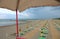 sun umbrellas on the beach from the lifeguard watching tower