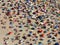 Sun umbrellas on a crowded beach