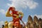 Sun Wukong statue of magic monkey in front of three stupa temple