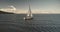 Sun yachts with white sails at ocean bay aerial. Luxury yachting on sailboat in open sea lifestyle