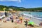 Sunbathers in Cala Nova Beach, in Ibiza, Spain