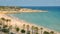 Sunbathers at Miracle Beach in Tarragona, Spain