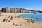 Sunbathers at Platja de Lloret beach in Lloret de Mar, Spain