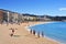 Sunbathers at Platja de Lloret beach in Lloret de Mar, Spain