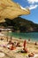 Sunbathers on sandy Mediterranean beach Greek island of Corfu.